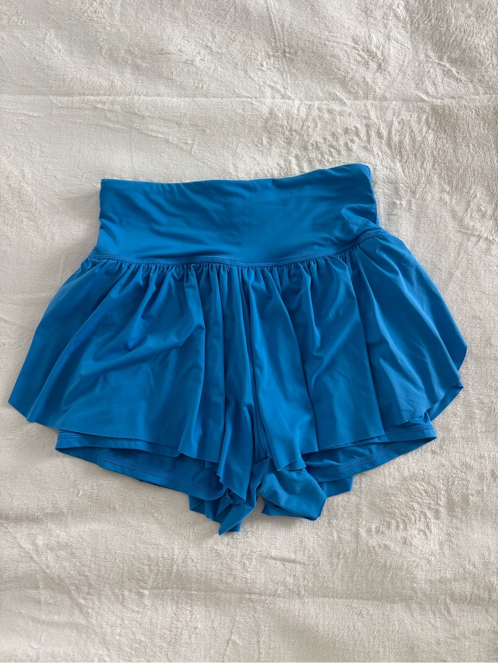 Blue flowy athletic shorts